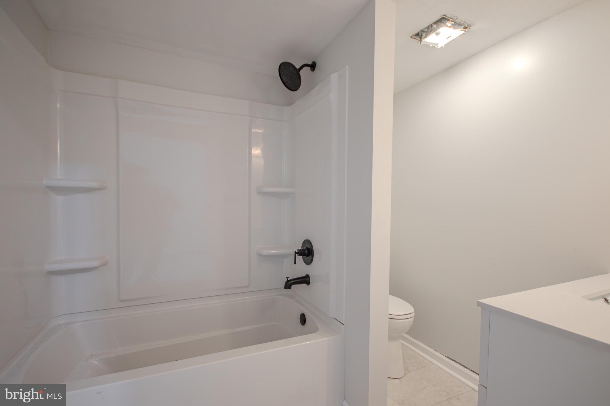 5693 Landon Store Road Marion Station, MD 21838 - Photo 9 of 20 a bathroom with a bathtub