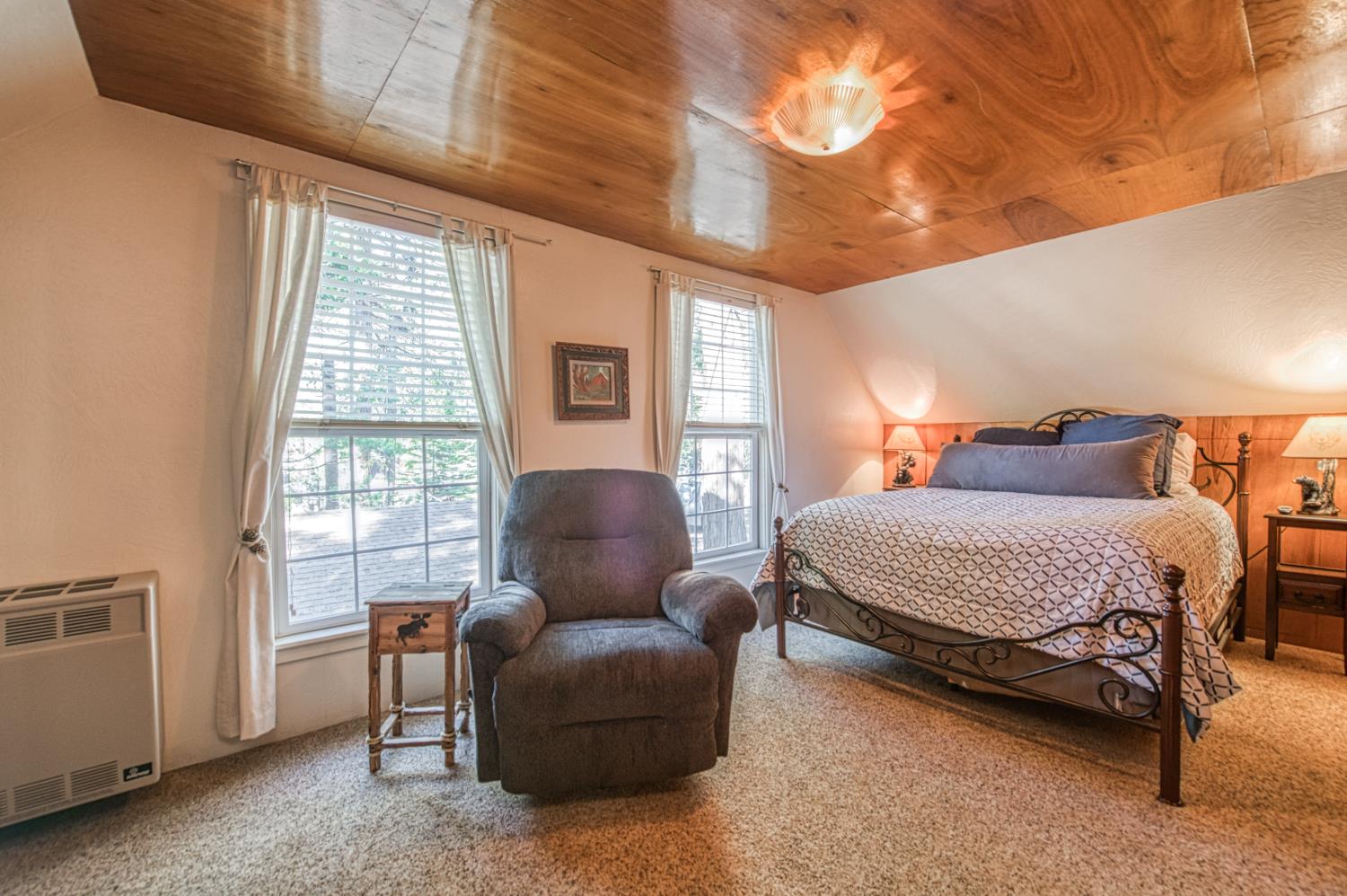 42088 North Elderberry Road Shaver Lake, CA 93664 - Photo 21 of 49 a bedroom with furniture and a window