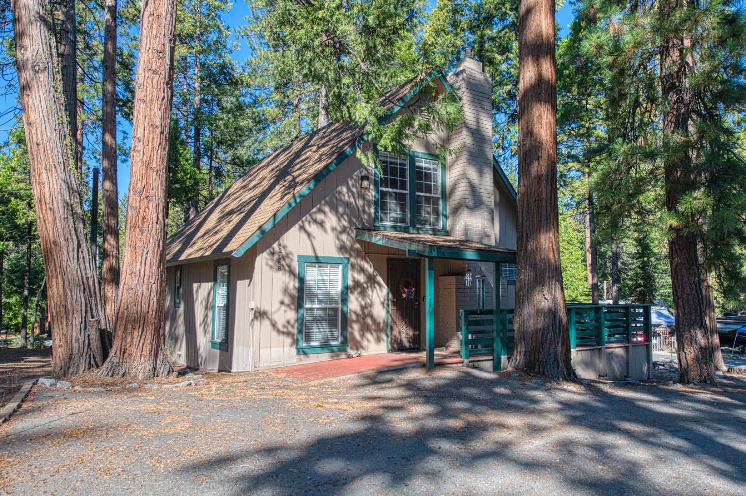42088 North Elderberry Road Shaver Lake, CA 93664 - Photo 27 of 49 a front view of a house with a tree