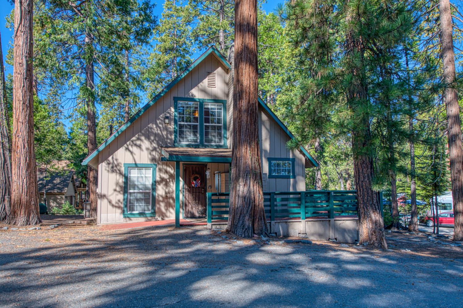 42088 North Elderberry Road Shaver Lake, CA 93664 - Photo 28 of 49 a view of a house with a tree next to a road