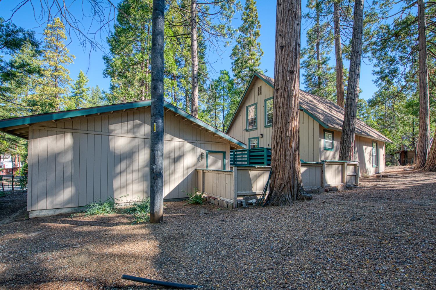 42088 North Elderberry Road Shaver Lake, CA 93664 - Photo 32 of 49 a view of a house with a tree in the background