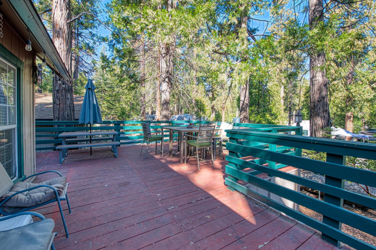 42088 North Elderberry Road Shaver Lake, CA 93664 - Photo 36 of 49 a view of a bench in a backyard