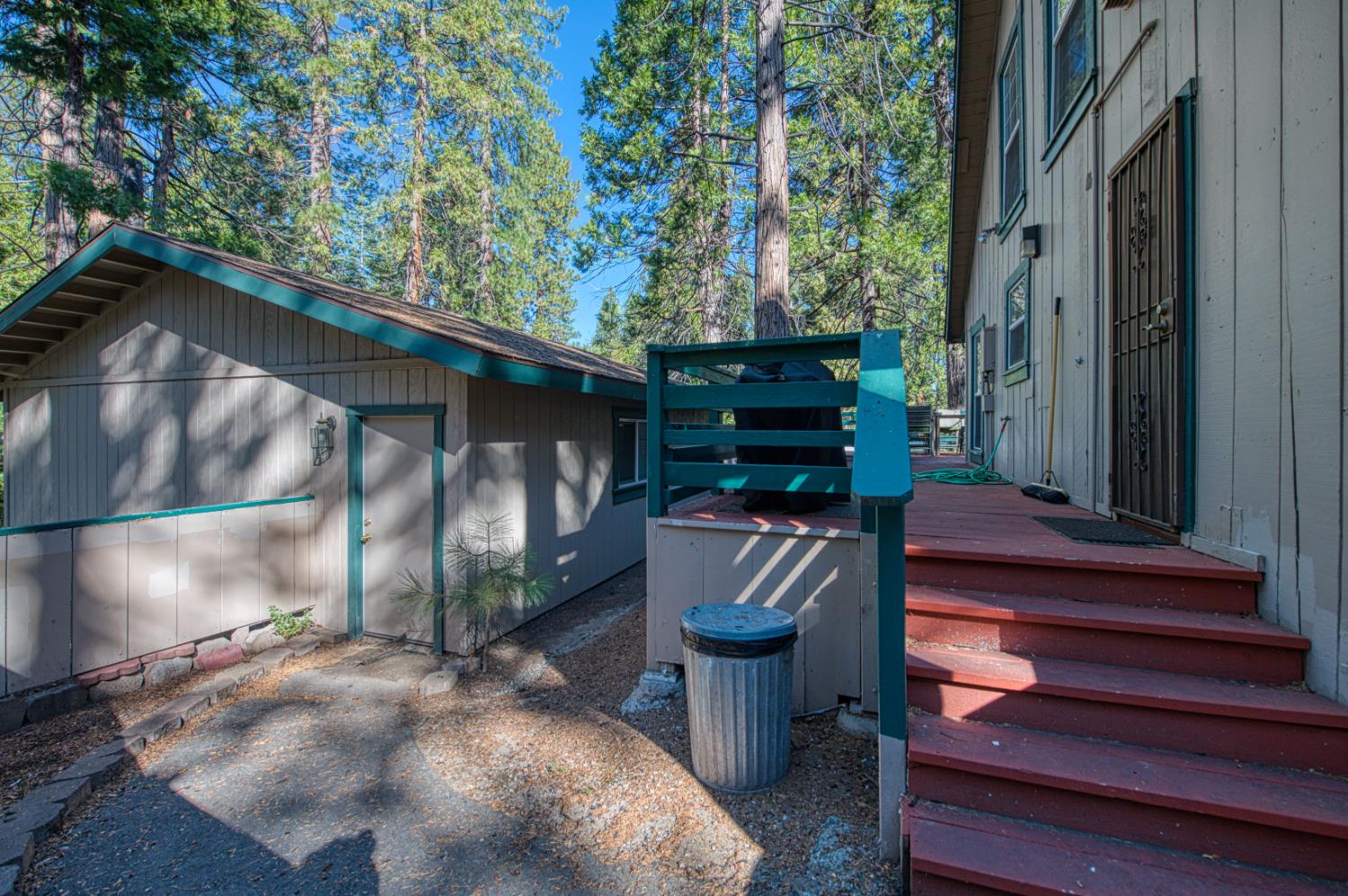 42088 North Elderberry Road Shaver Lake, CA 93664 - Photo 39 of 49 a view of a patio with table and chairs with wooden floor and plants
