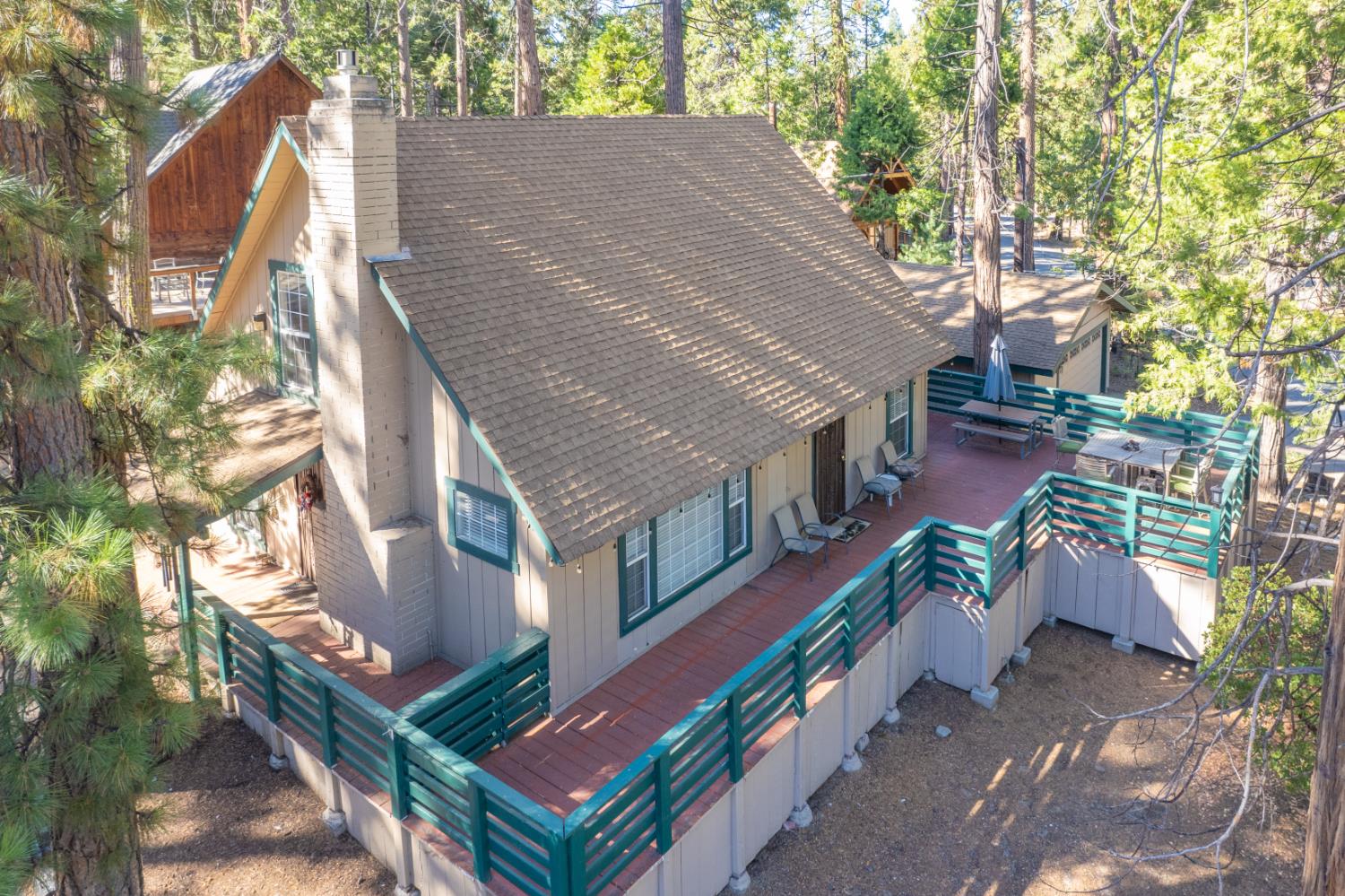 42088 North Elderberry Road Shaver Lake, CA 93664 - Photo 42 of 49 a aerial view of a house with a yard and potted plants