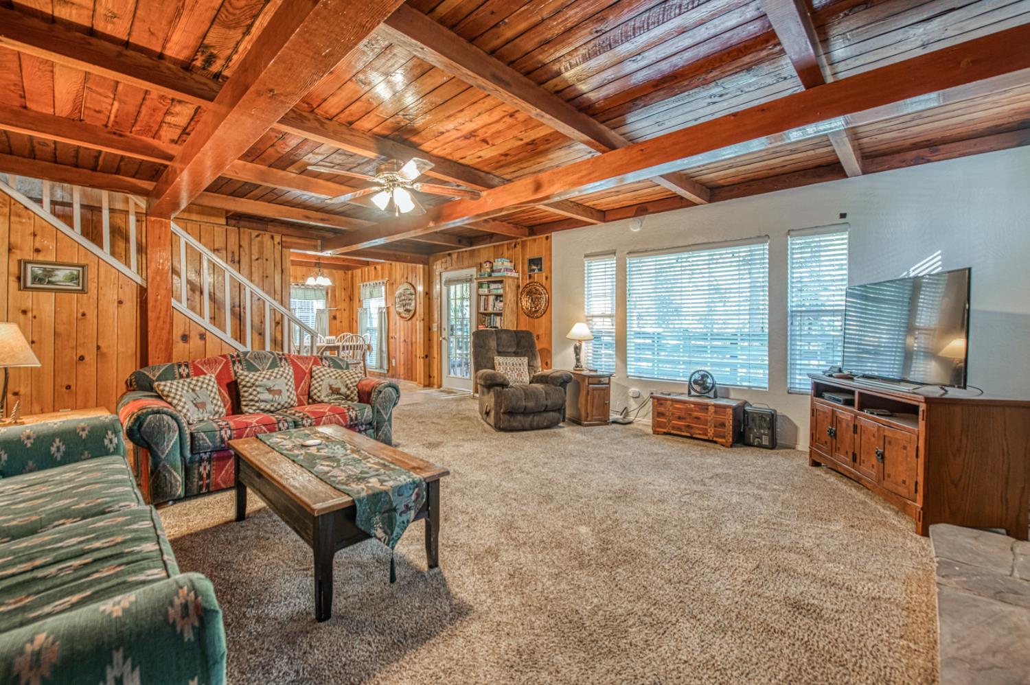 42088 North Elderberry Road Shaver Lake, CA 93664 - Photo 5 of 49 a living room with furniture and a flat screen tv