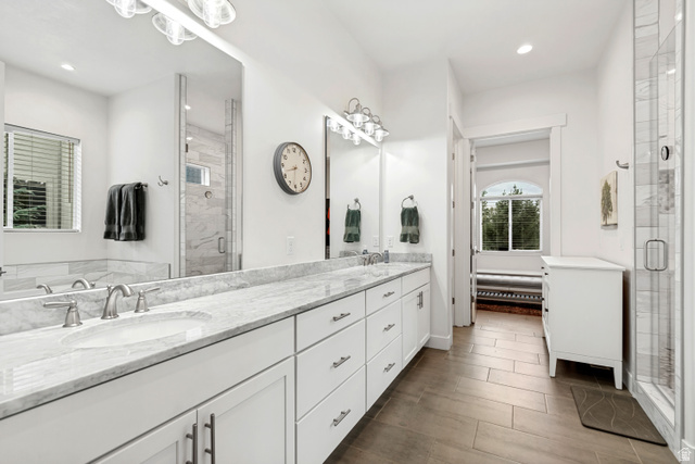 1912 Somerset Ridge Drive Draper, UT 84020 - Photo 20 of 45 Double vanity with undermount sinks, marble countertops, and brushed nickel fixtures