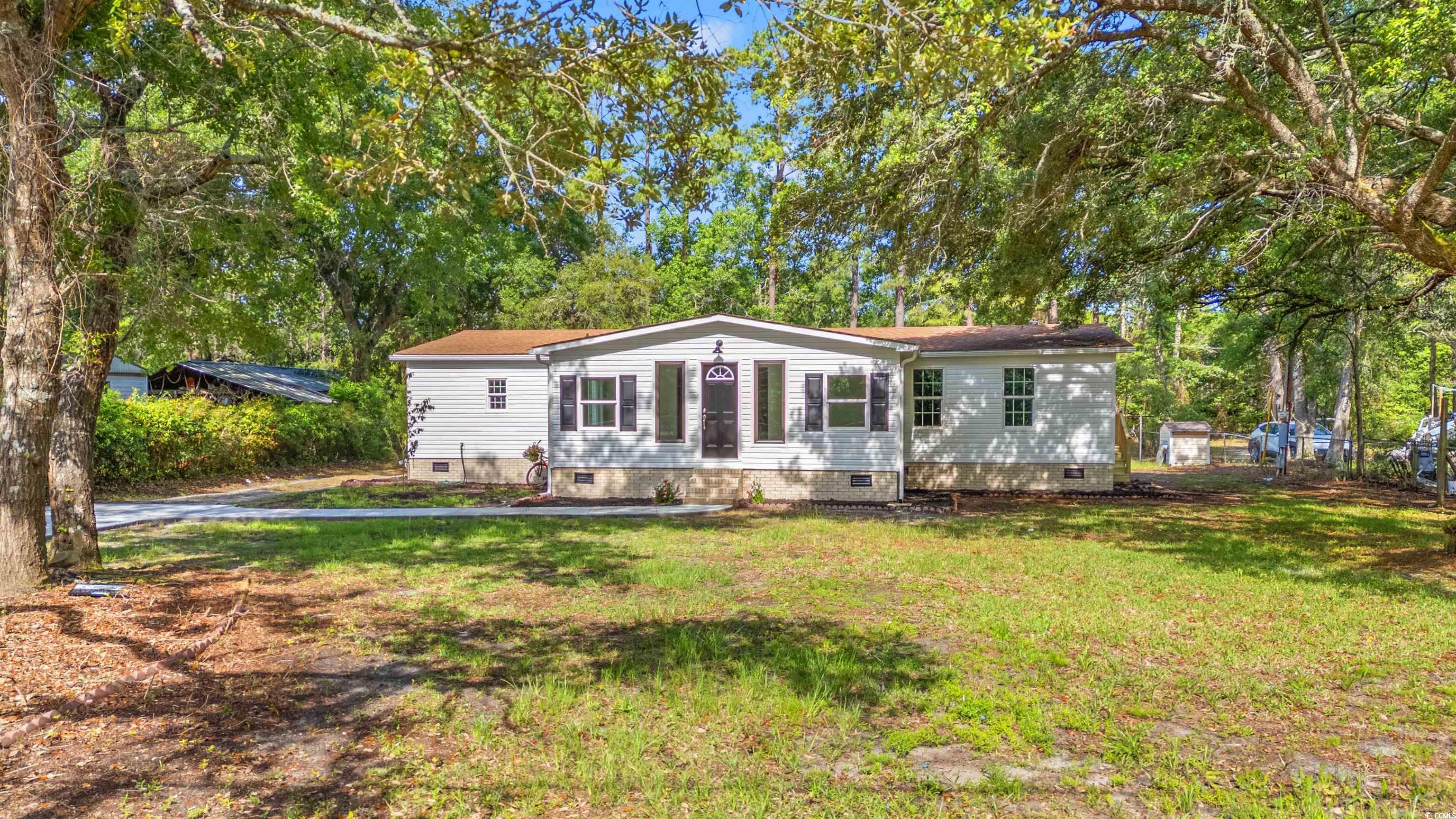5074 County Rd S-22-749 Murrells Inlet, SC 29576 - Photo 28 of 39 Manufactured / mobile home featuring crawl space and a front lawn