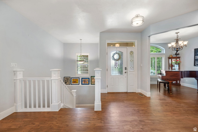 357 South 320 W Street Lindon, UT 84042 - Photo 21 of 41 Entry foyer featuring wood-finish flooring, a white paneled front door with decorative glass inserts, and a transom window