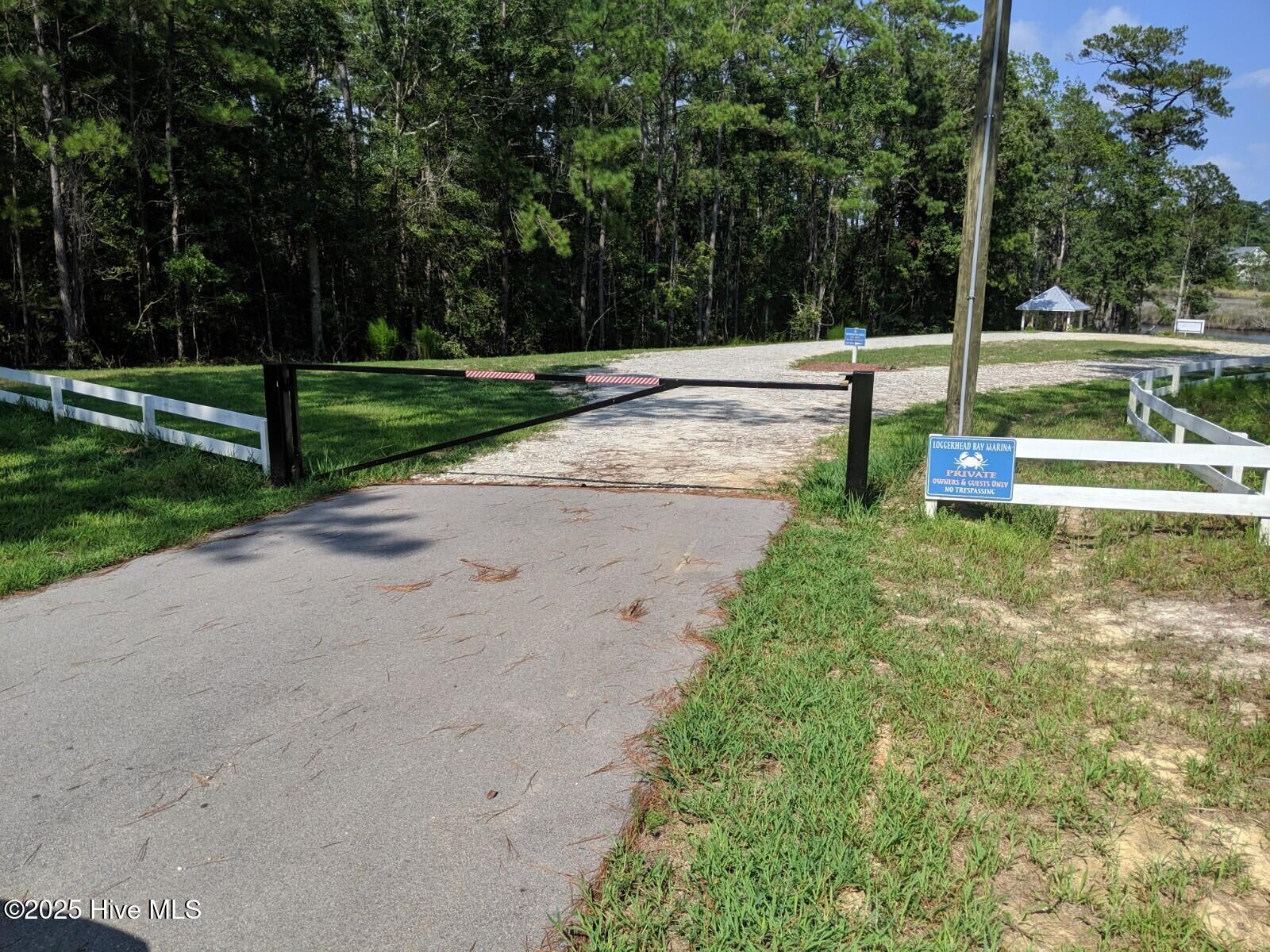 167 Gus Horne Road Holly Ridge, NC 28445 - Photo 8 of 13 Privacy Gate to Boat Launch