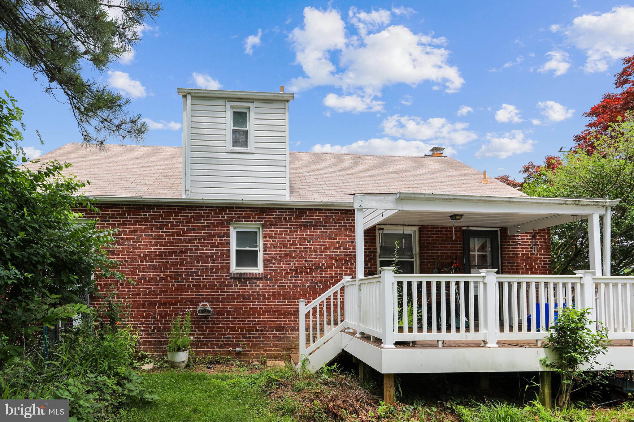 11509 Newport Mill Road Silver Spring, MD 20902 - Photo 5 of 31 Back of house with covered deck
