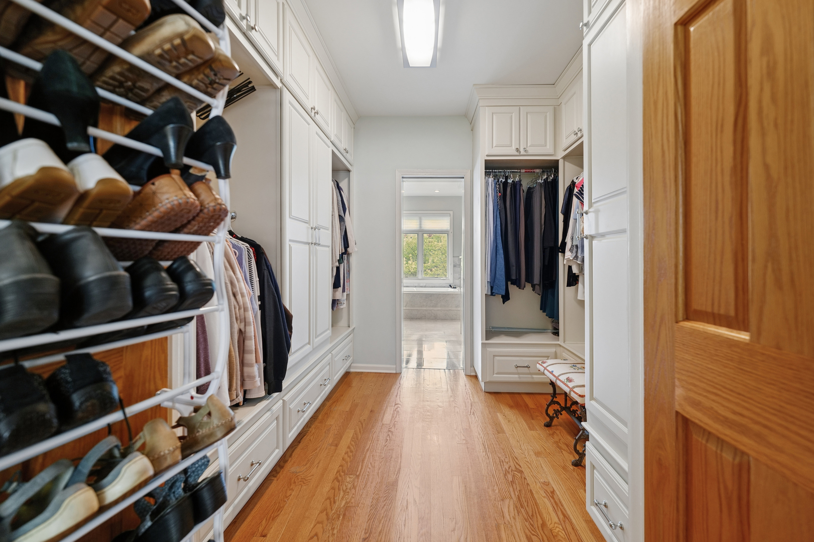 1401 South Indiana Avenue Chicago, IL 60605 - Photo 16 of 40 a view of walk in closet with clothes and shoes