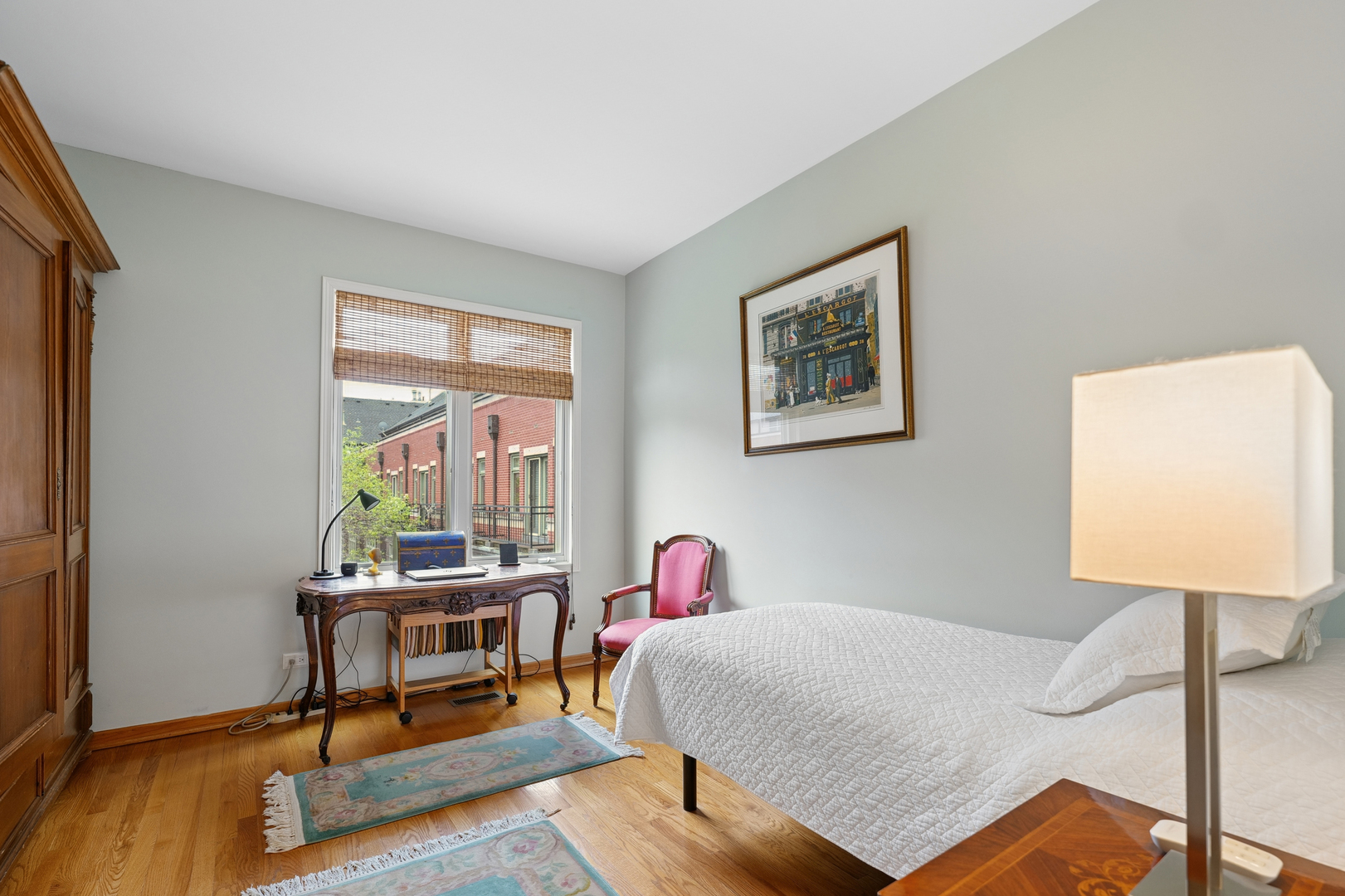 1401 South Indiana Avenue Chicago, IL 60605 - Photo 19 of 40 a bedroom with a bed a table and chair