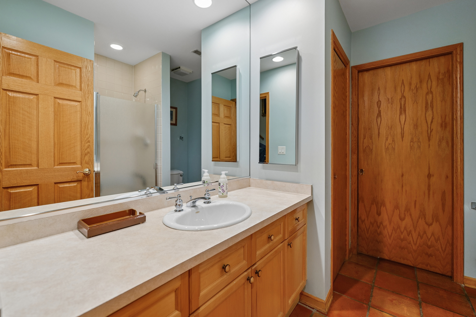 1401 South Indiana Avenue Chicago, IL 60605 - Photo 23 of 40 a bathroom with a sink double vanity and a mirror