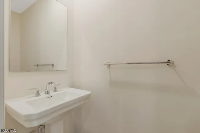 a bathroom with a sink and a white vanity