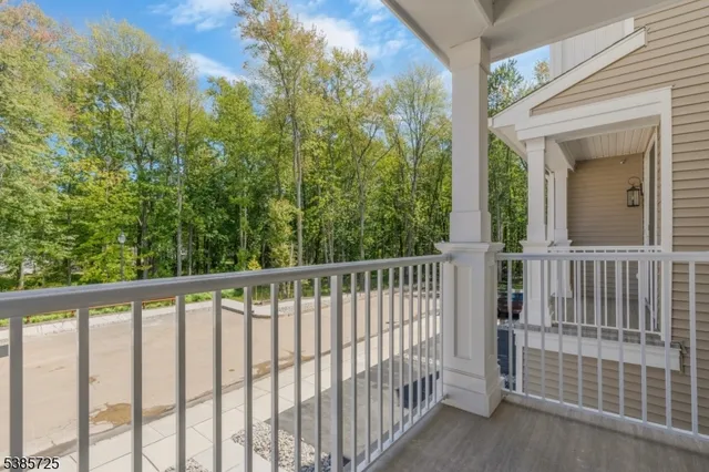a view of a balcony with yard