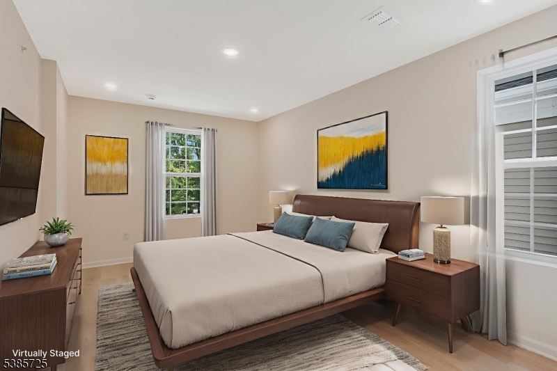 219 Myrtle Road Warren, NJ 07059 - Photo 25 of 33 a bedroom with a bed and a flat screen tv