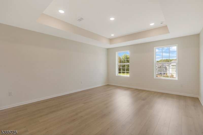 219 Myrtle Road Warren, NJ 07059 - Photo 27 of 33 an empty room with wooden floor and windows