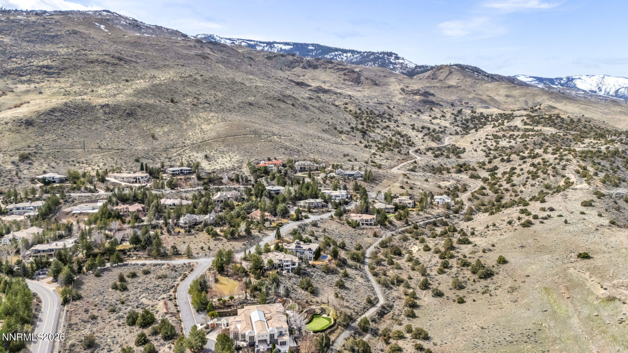4387 Sharps Road Reno, NV 89519 - Photo 11 of 12 a view of a mountain range with trees in the background