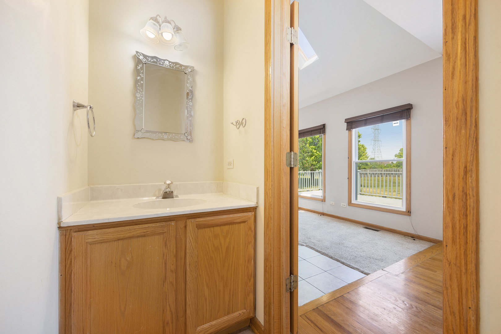 24859 Vermette Road Plainfield, IL 60585 - Photo 11 of 39 a bathroom with a sink and a mirror