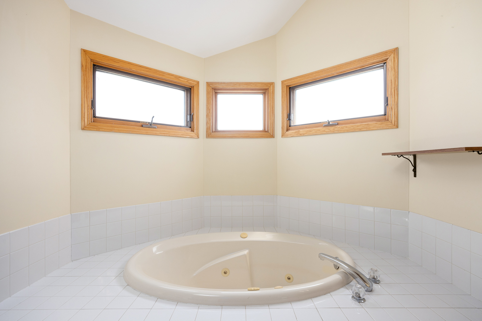 24859 Vermette Road Plainfield, IL 60585 - Photo 18 of 39 a bathroom with a white bath tub and a window