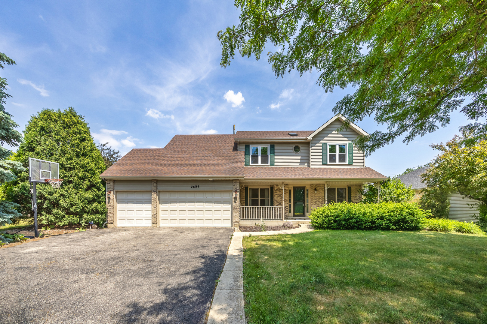 24859 Vermette Road Plainfield, IL 60585 - Photo 2 of 39 a front view of a house with a yard