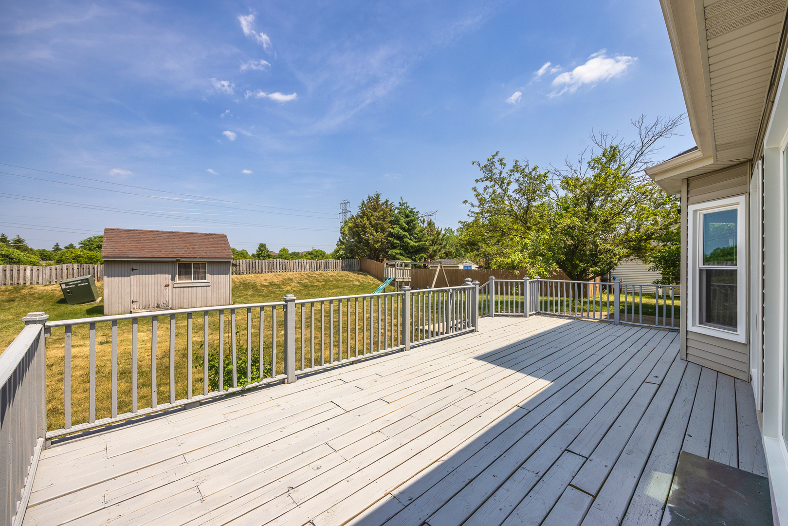 24859 Vermette Road Plainfield, IL 60585 - Photo 32 of 39 a view of balcony with wooden floor and fence