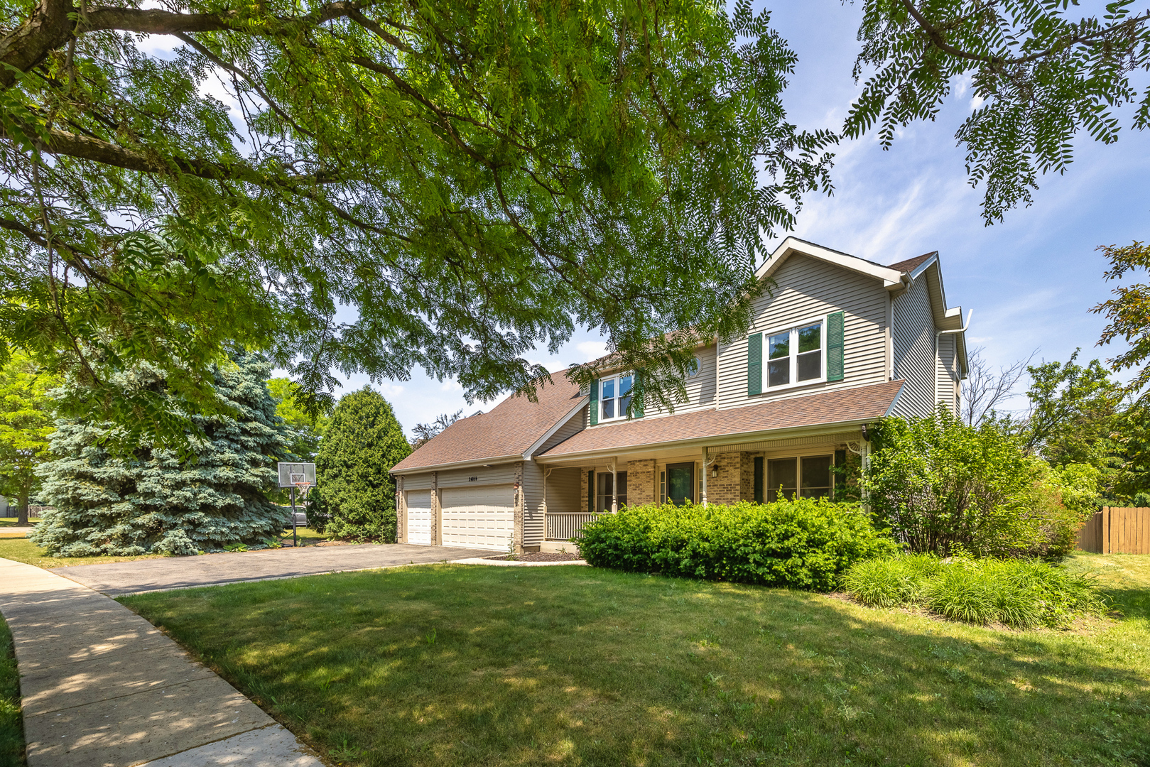 24859 Vermette Road Plainfield, IL 60585 - Photo 4 of 39 a front view of a house with a yard