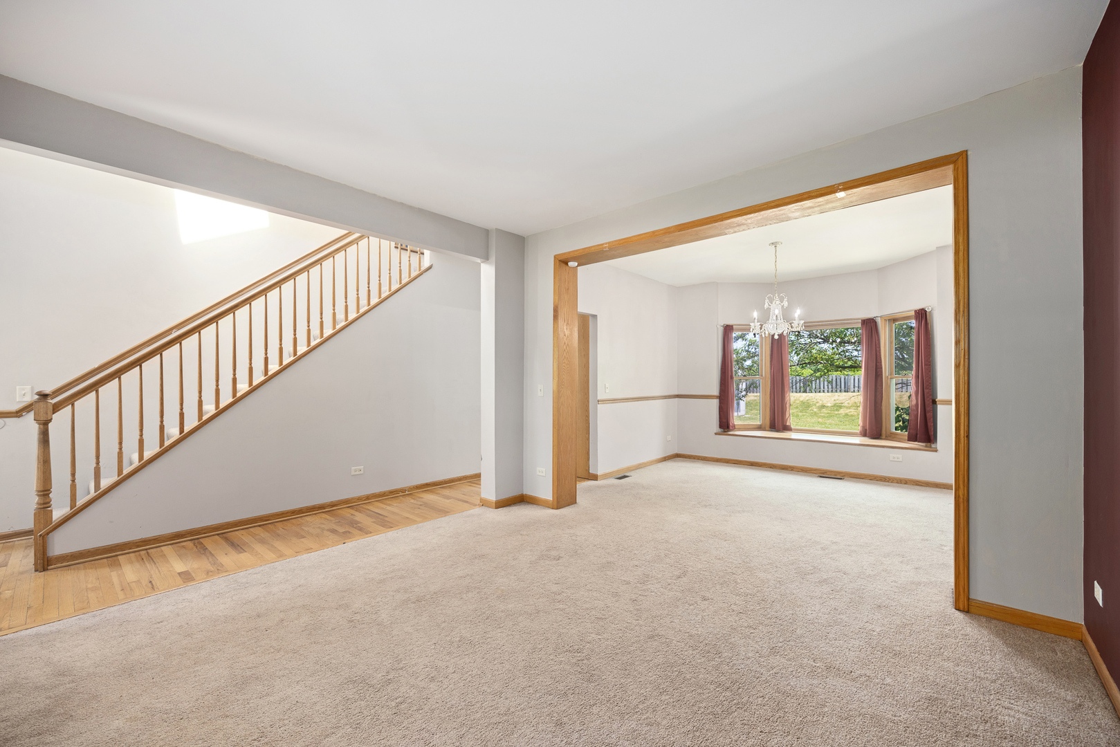 24859 Vermette Road Plainfield, IL 60585 - Photo 6 of 39 a view of a big room with wooden floor and windows