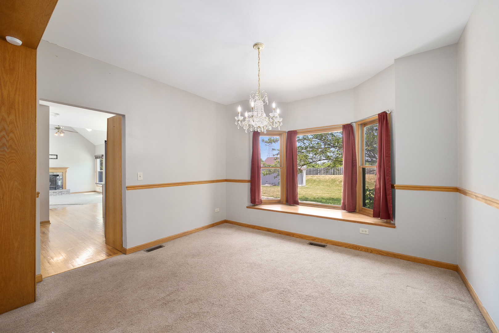 24859 Vermette Road Plainfield, IL 60585 - Photo 7 of 39 a view of an empty room with window and chandelier