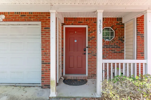 a view of a door and a window