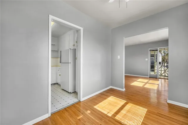a kitchen with a refrigerator and a sink