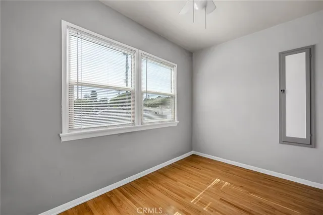 an aerial view of multiple houses with a yard