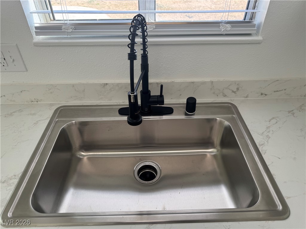 4020 Pamela Way Las Vegas, NV 89115 - Photo 14 of 38 View of the backyard while doing dishes is a wonderful thing.