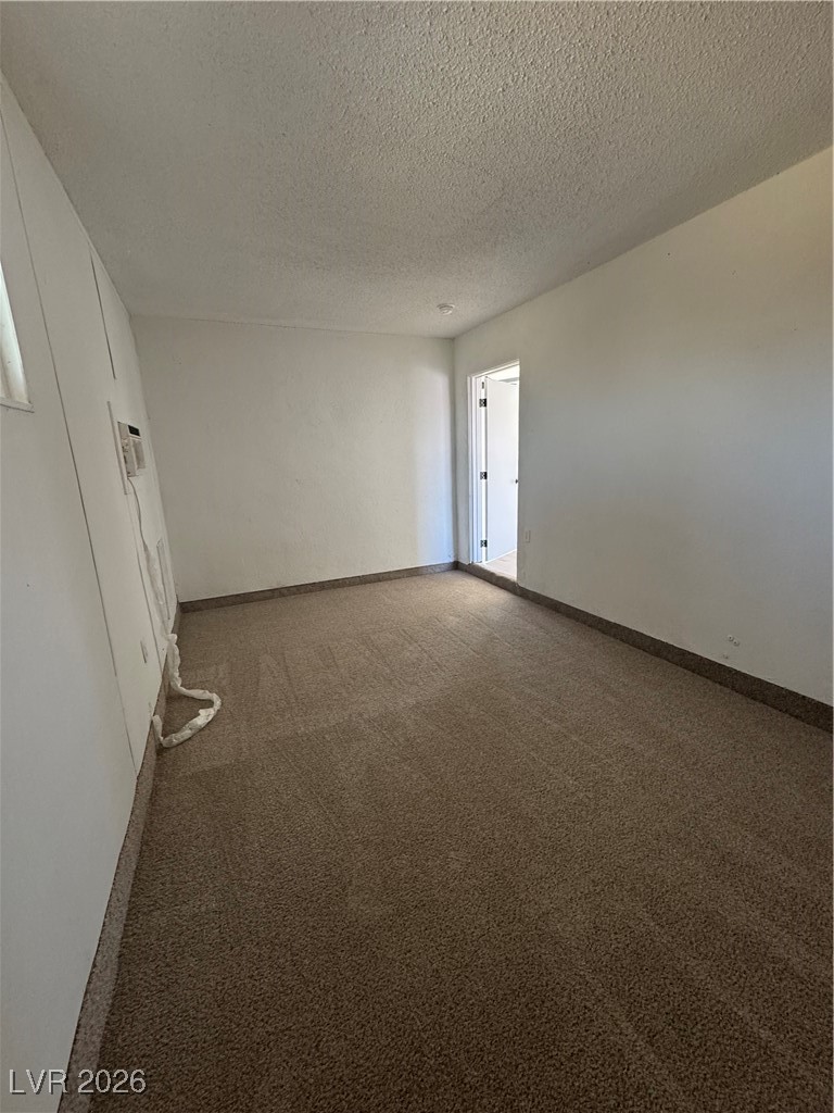 4020 Pamela Way Las Vegas, NV 89115 - Photo 22 of 38 Looking back towards the living room access door. This is a large room.