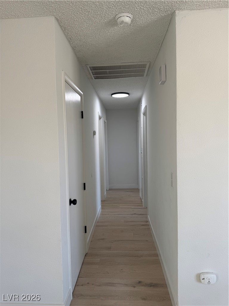 4020 Pamela Way Las Vegas, NV 89115 - Photo 24 of 38 Hallway with linen closet leads to bedrooms and the 2nd bathroom.