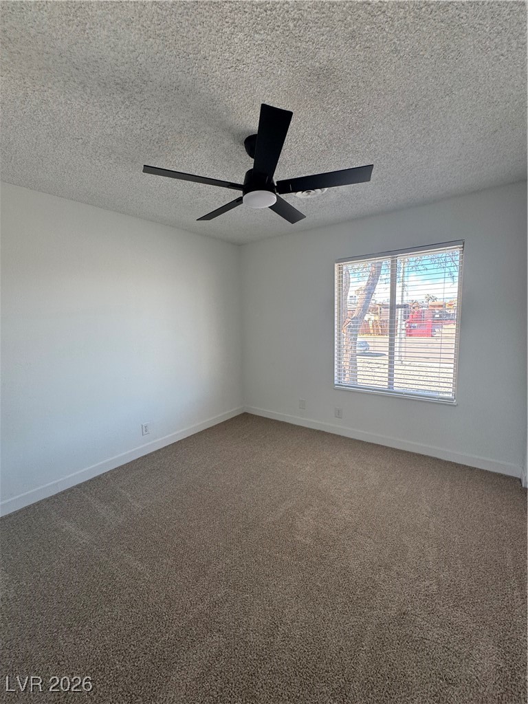 4020 Pamela Way Las Vegas, NV 89115 - Photo 28 of 38 3rd bedroom with new carpet, ceiling fan, and window blinds.
