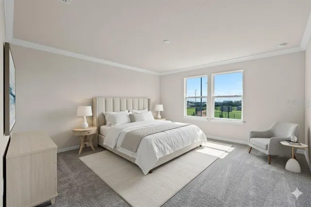 a bedroom with a bed and window