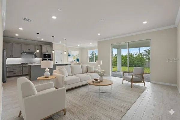 a living room with furniture and a large window