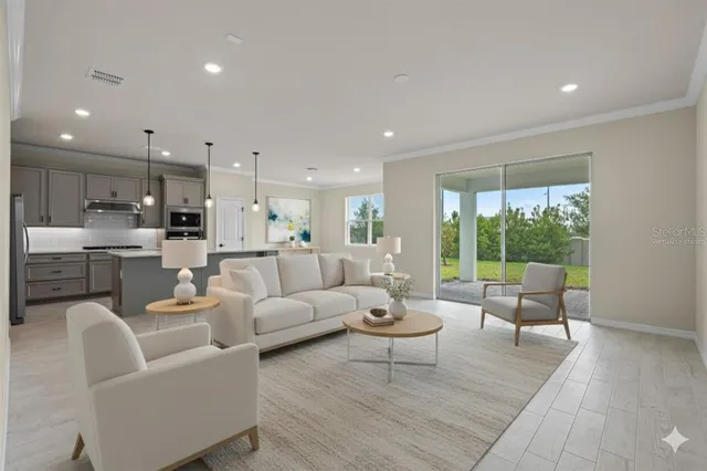 a living room with furniture and a large window