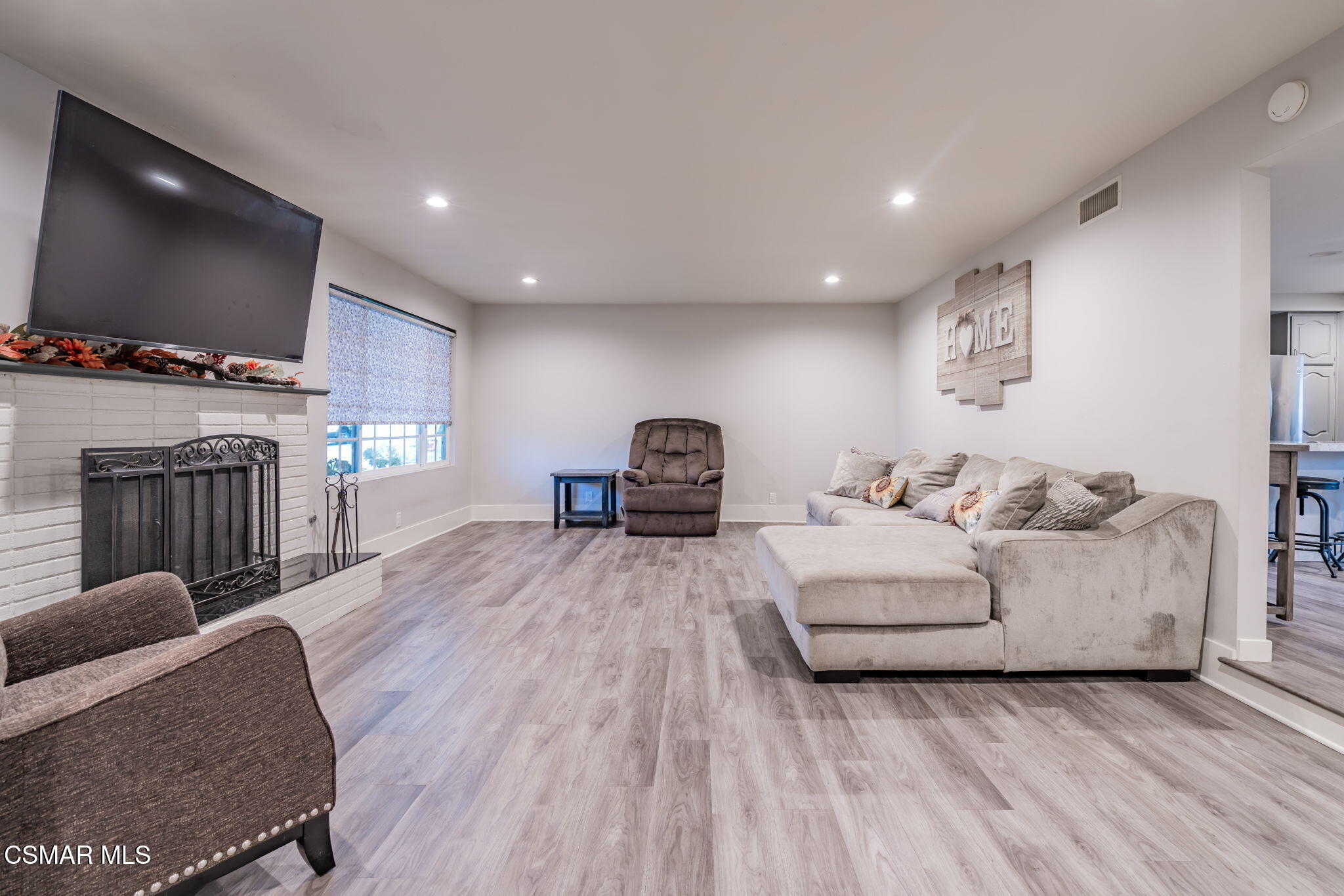 761 Lyons Court Simi Valley, CA 93065 - Photo 11 of 61 a living room with furniture and a flat screen tv