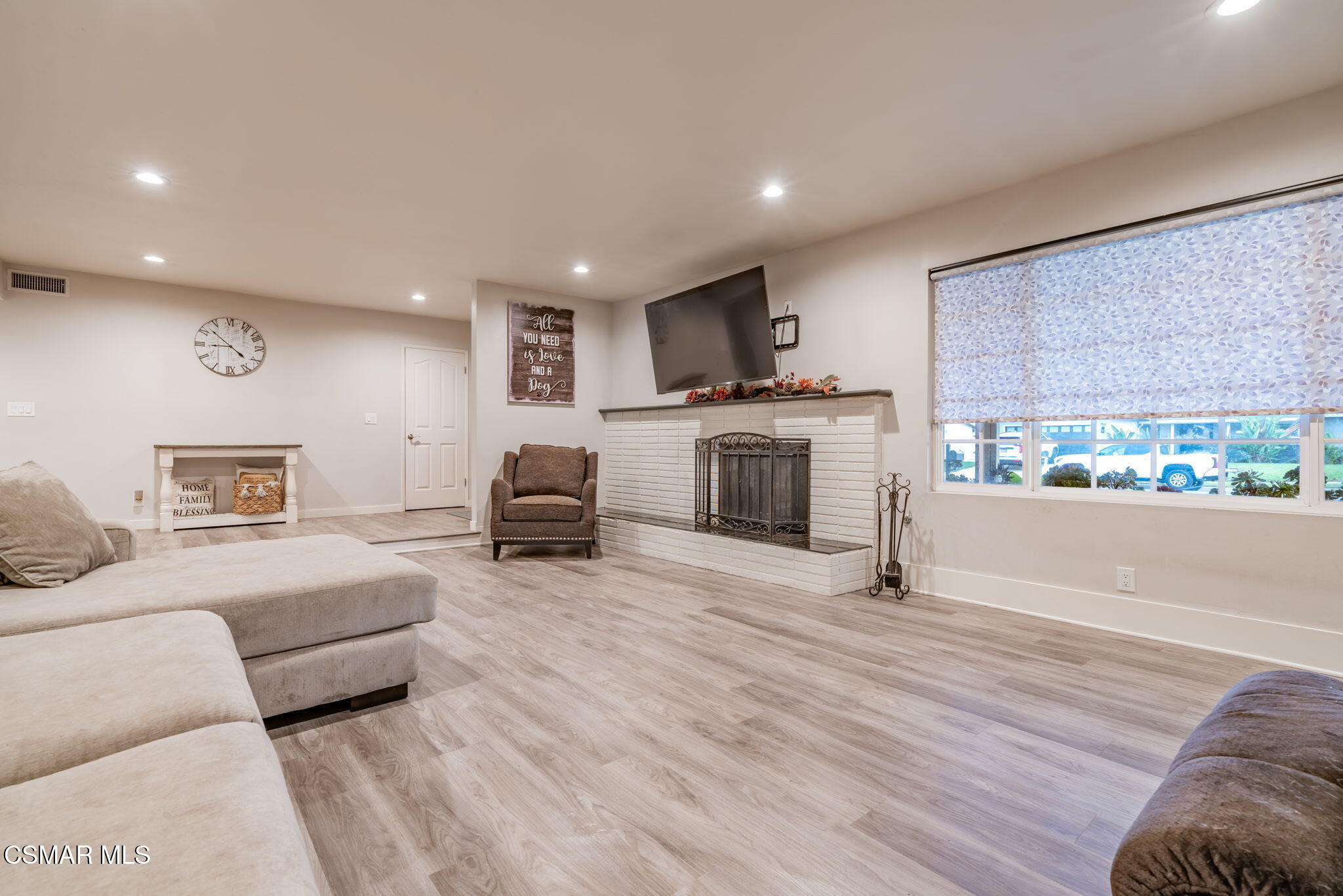 761 Lyons Court Simi Valley, CA 93065 - Photo 14 of 61 a living room with furniture and a fireplace