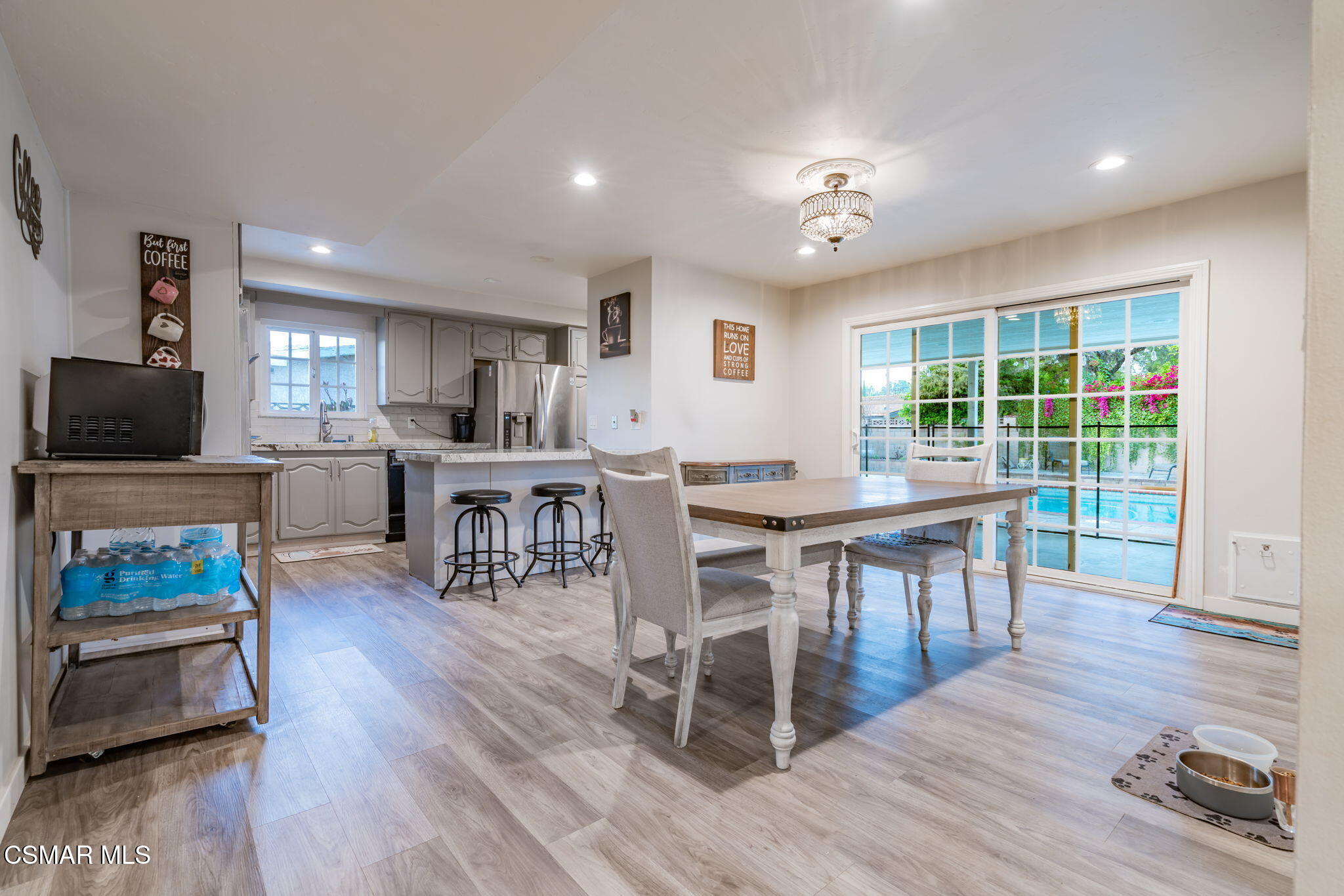 761 Lyons Court Simi Valley, CA 93065 - Photo 16 of 61 a view of a dining room with furniture a rug and wooden floor