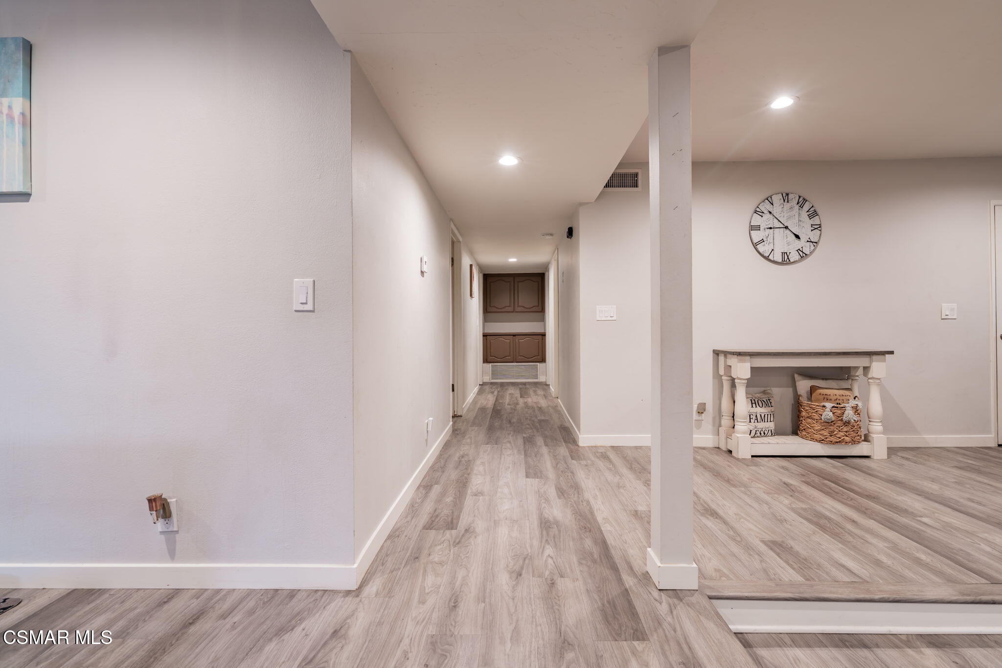 761 Lyons Court Simi Valley, CA 93065 - Photo 27 of 61 a view of a hallway with wooden floor and a bathroom