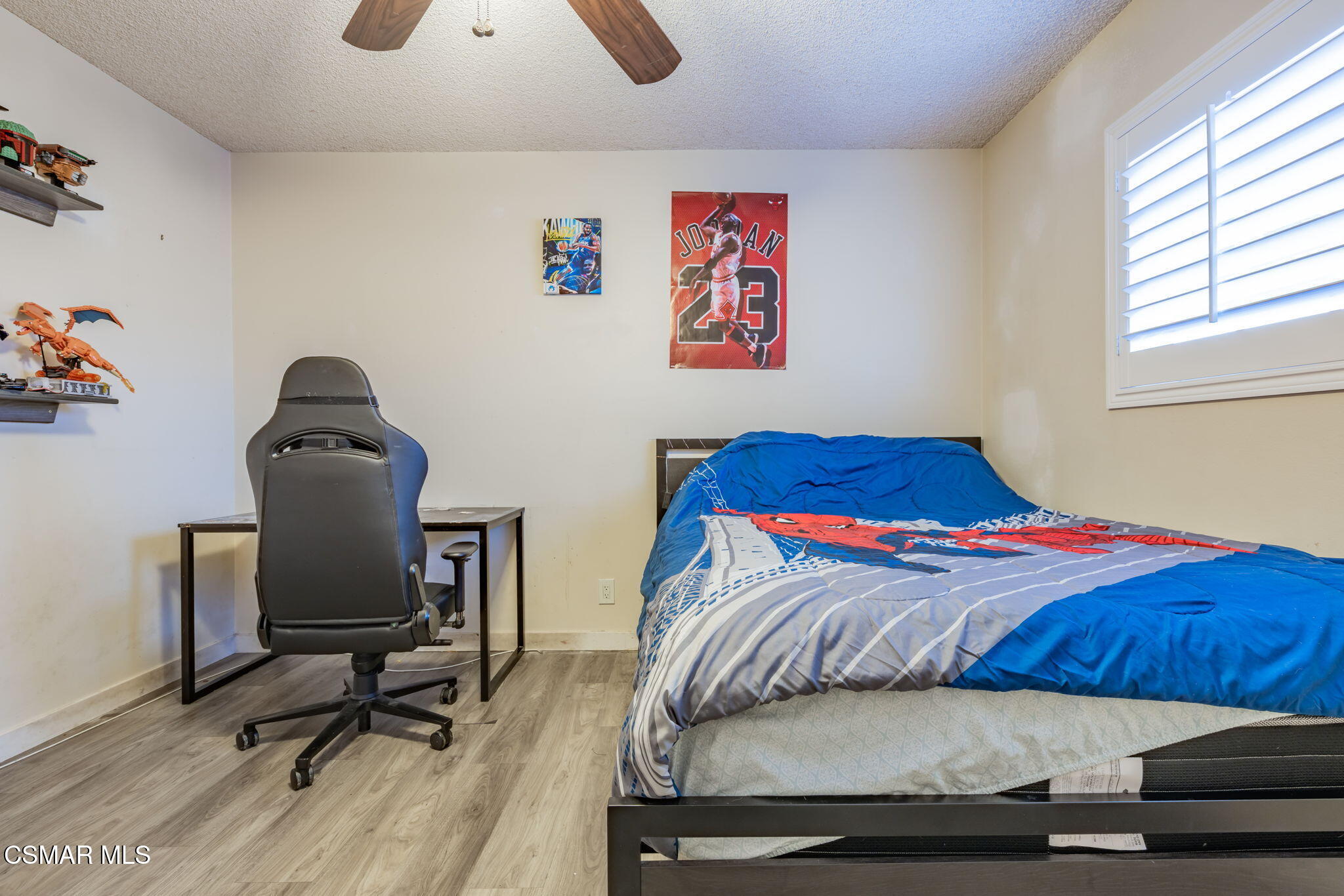 761 Lyons Court Simi Valley, CA 93065 - Photo 30 of 61 a bedroom with a bed and a chair