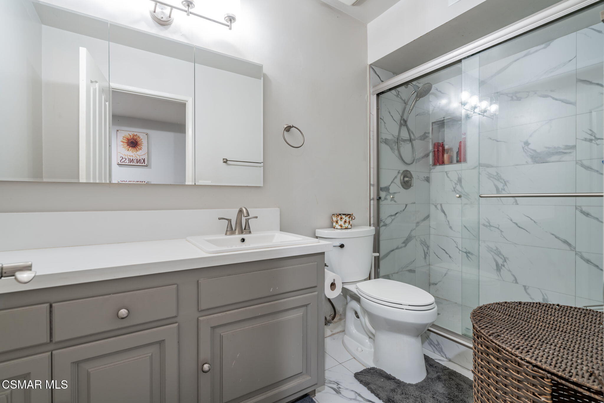 761 Lyons Court Simi Valley, CA 93065 - Photo 31 of 61 a bathroom with a sink a toilet and a mirror