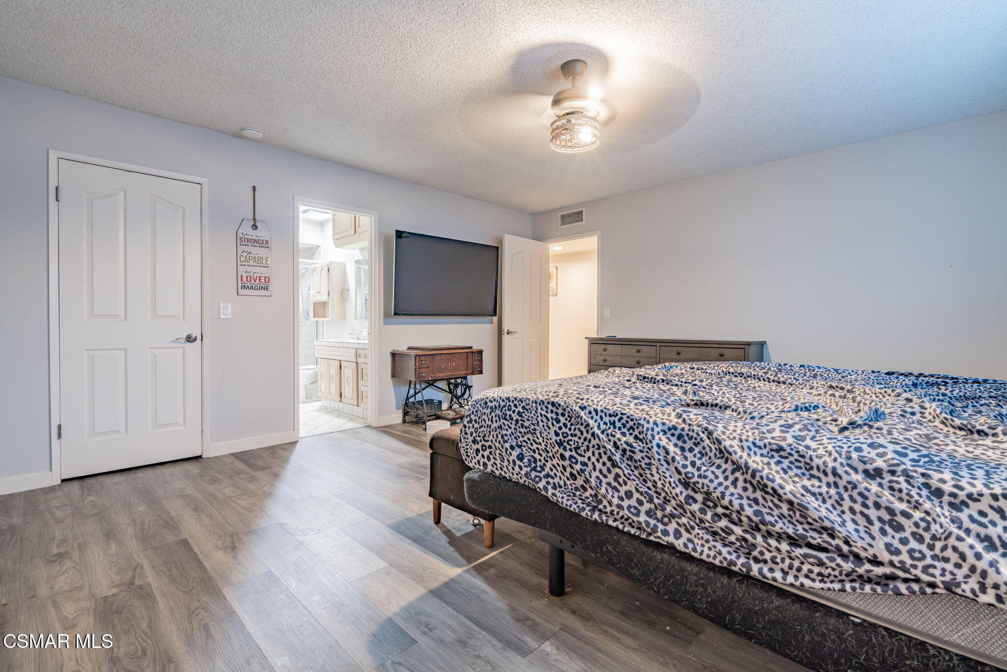 761 Lyons Court Simi Valley, CA 93065 - Photo 39 of 61 a bedroom with a bed and a flat screen tv