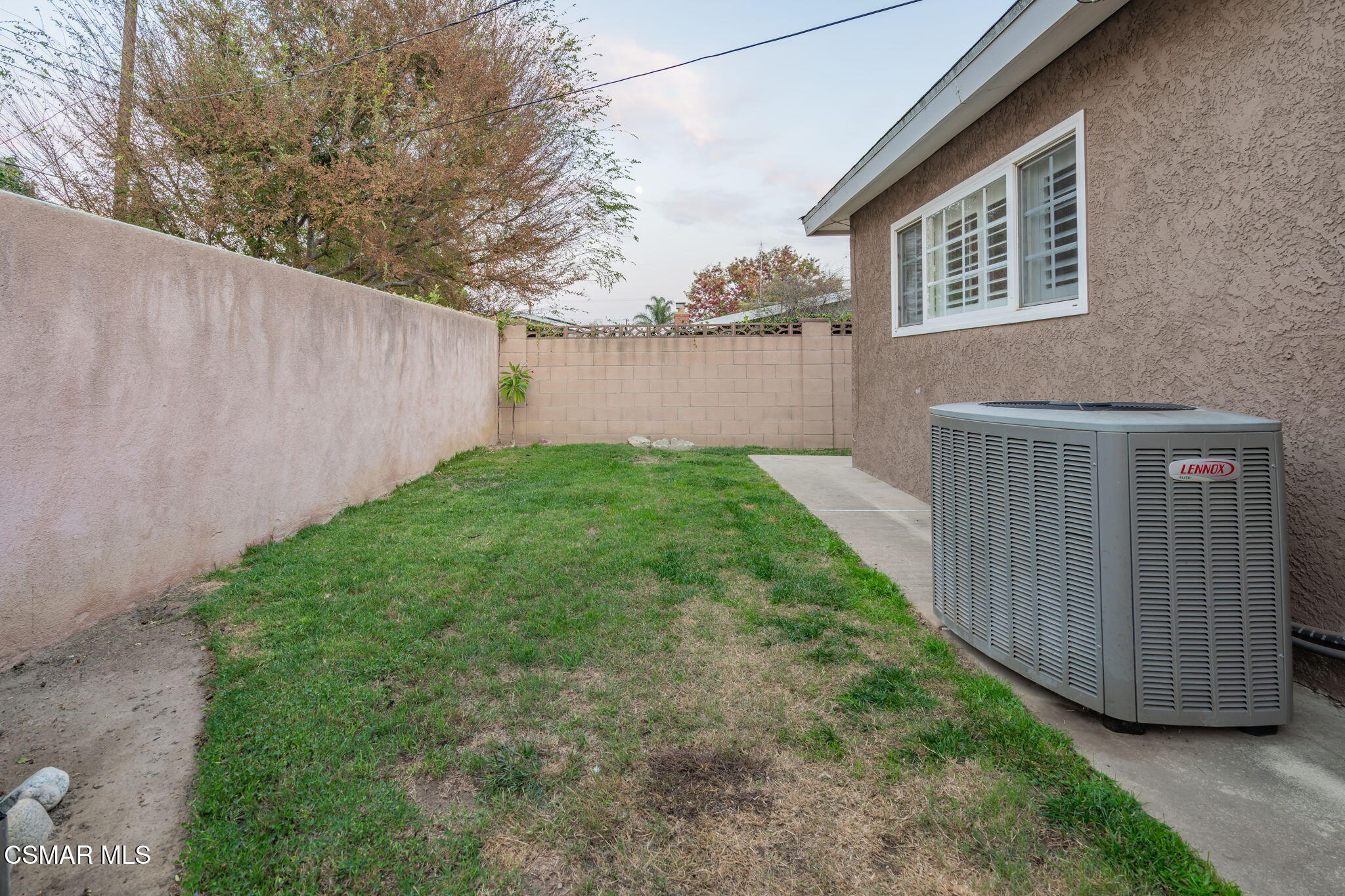 761 Lyons Court Simi Valley, CA 93065 - Photo 53 of 61 a view of a backyard with plants and wooden fence