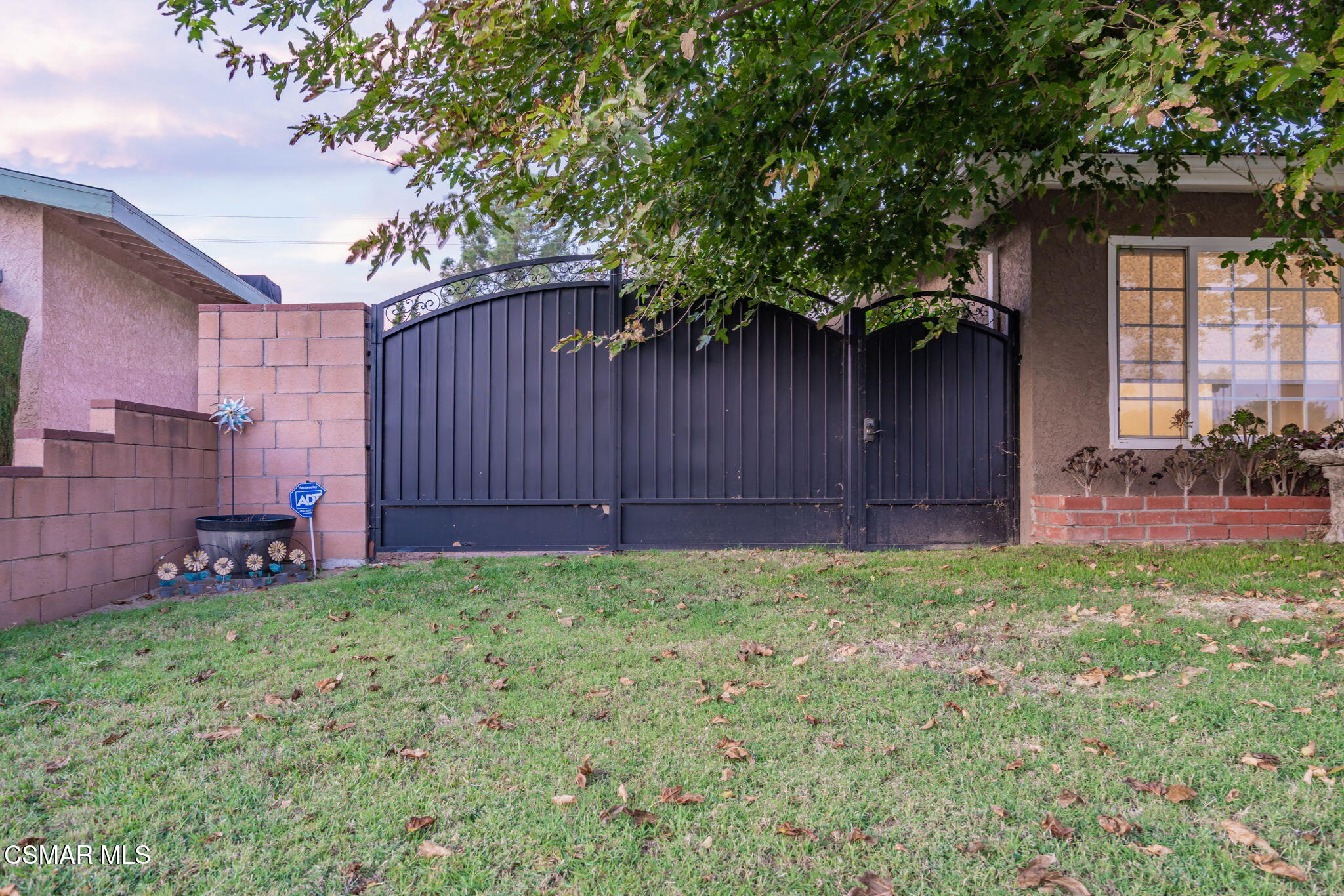 761 Lyons Court Simi Valley, CA 93065 - Photo 55 of 61 a view of a backyard with potted plants and a large tree