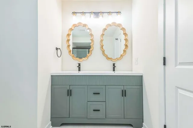 a bathroom with a sink and a mirror