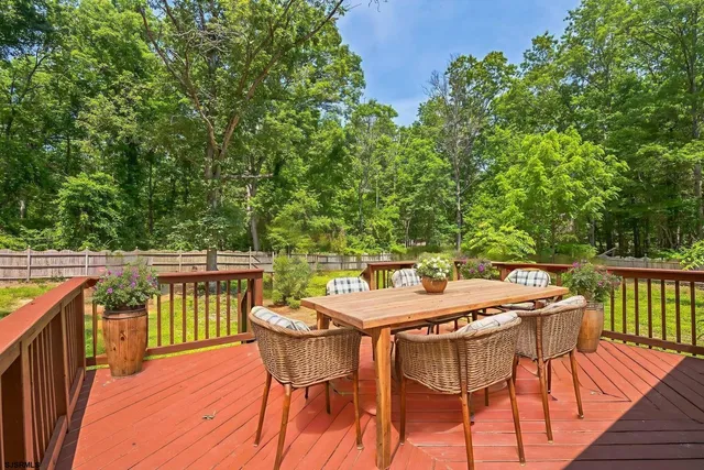 a view of a patio with a table and chairs